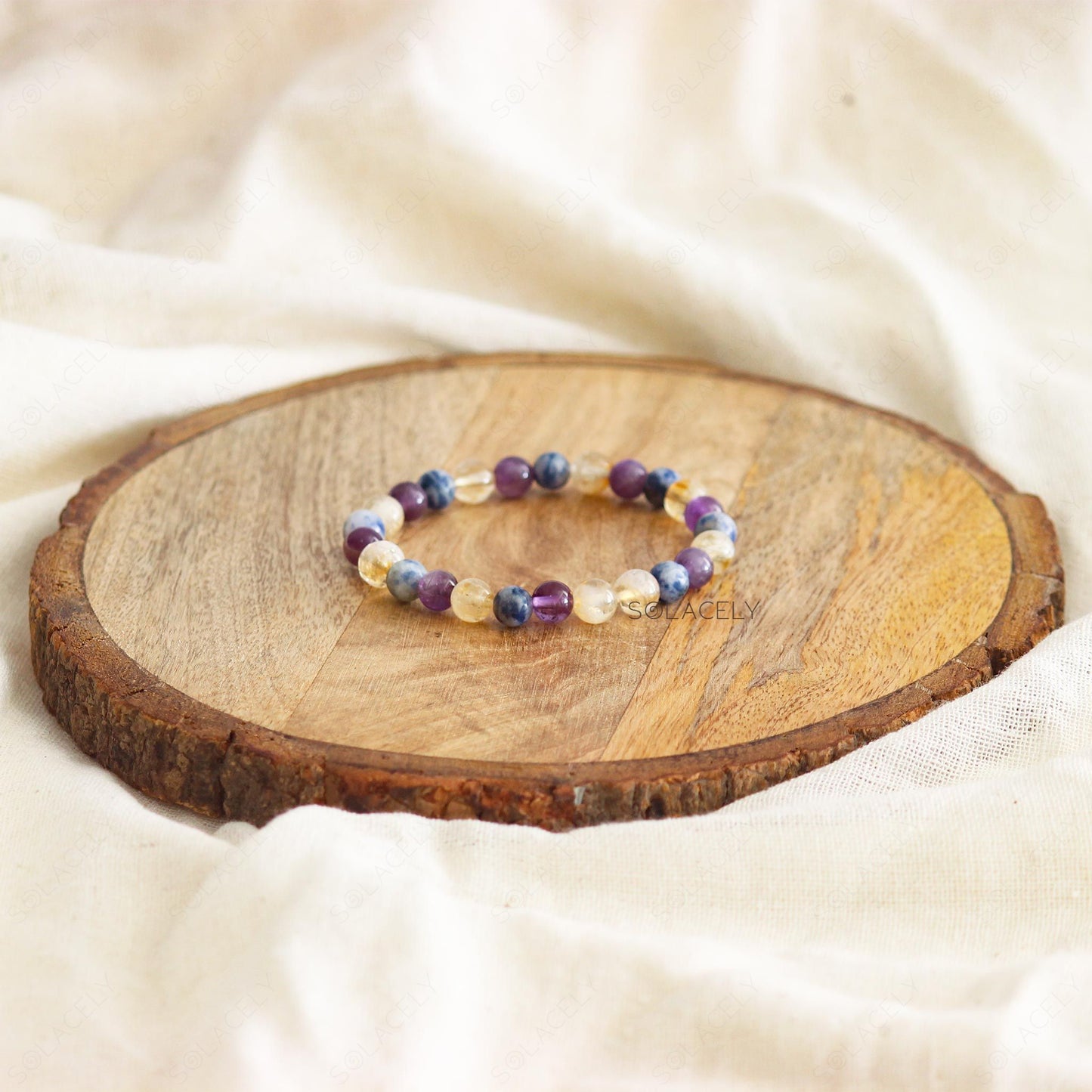 Anxiety and Stress Relief Bracelet on round wooden base