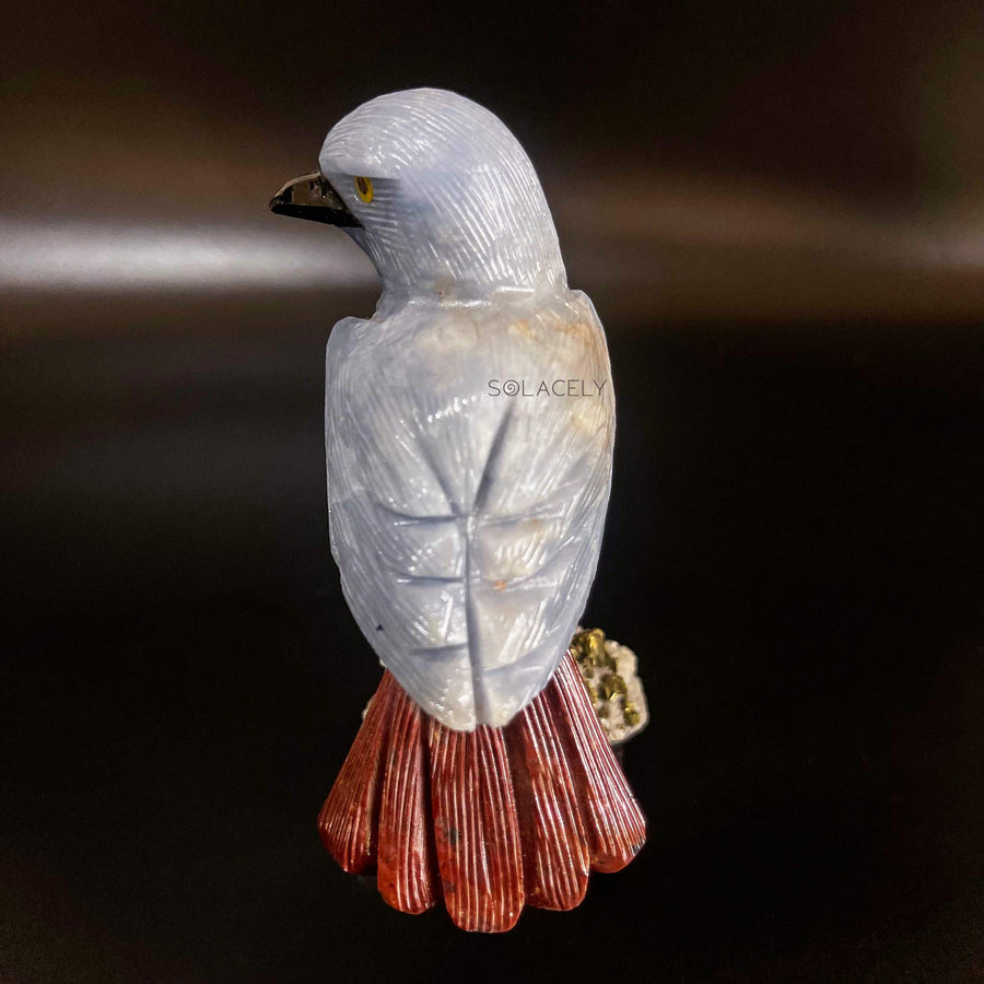 Decorative gemstone bird on stone