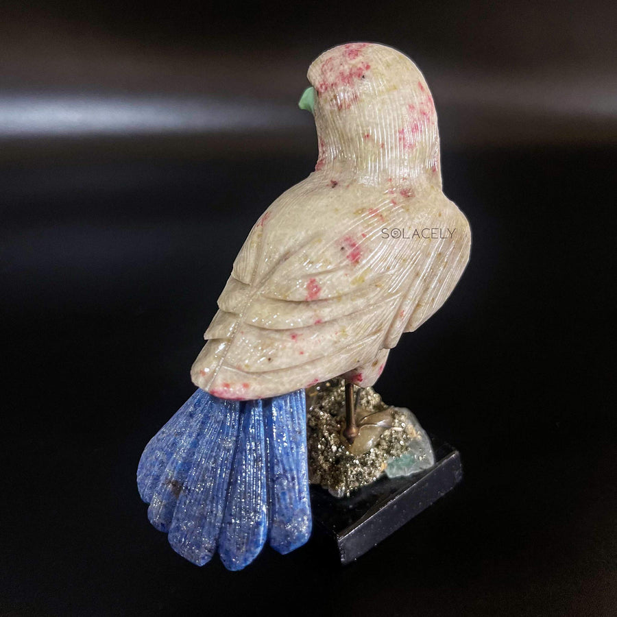Gemstone bird on stone