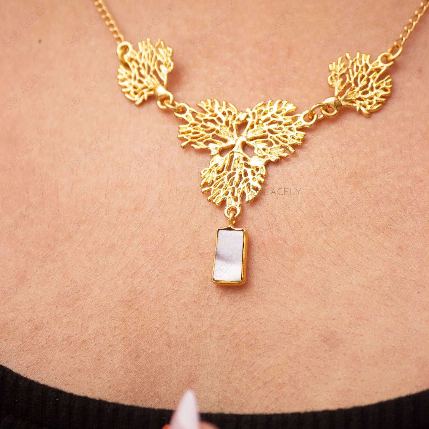 gold necklace with mother of pearl