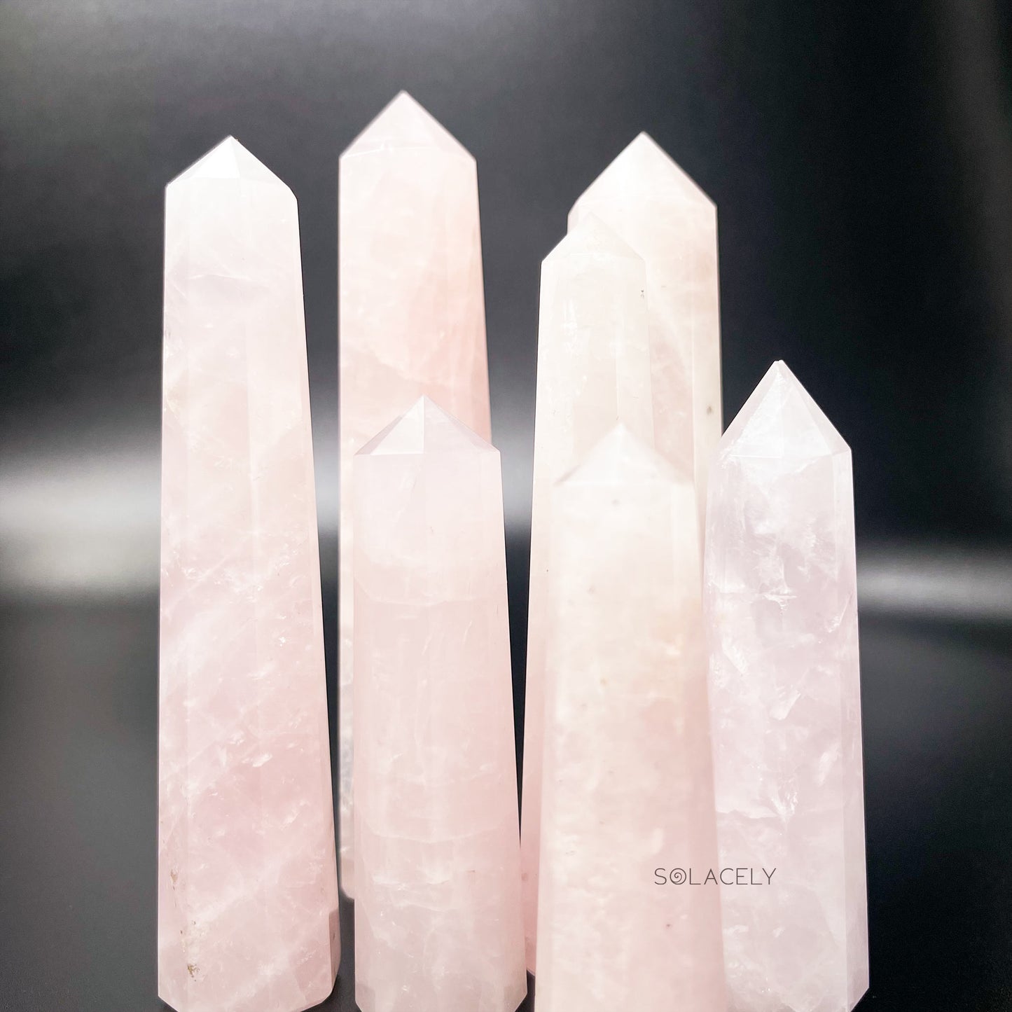 Polished rose quartz crystal wand