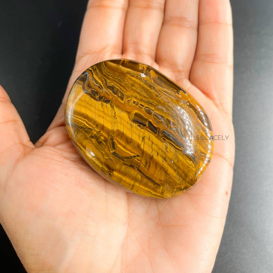 smooth tigers eye palm stone