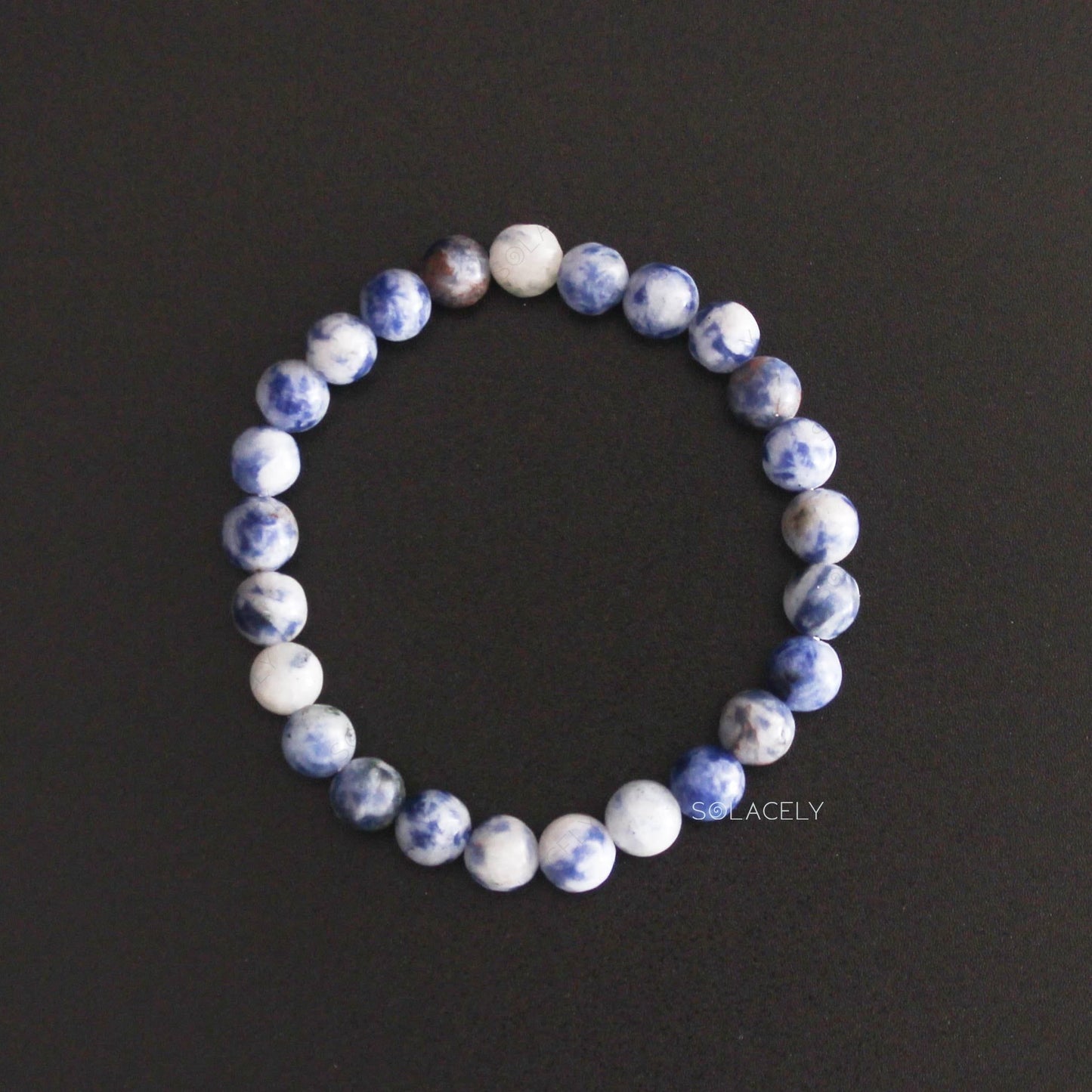 Sodalite Crystal 6mm Beads Bracelet top view on black background