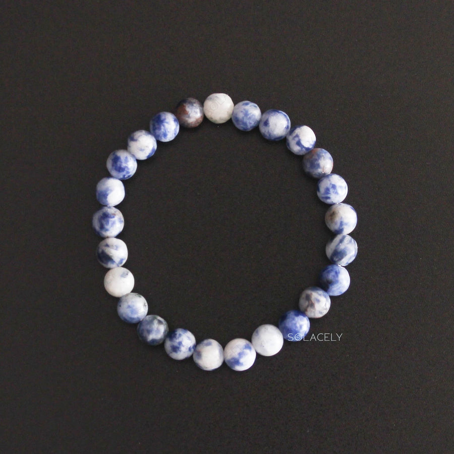 Sodalite Crystal 6mm Beads Bracelet top view on black background