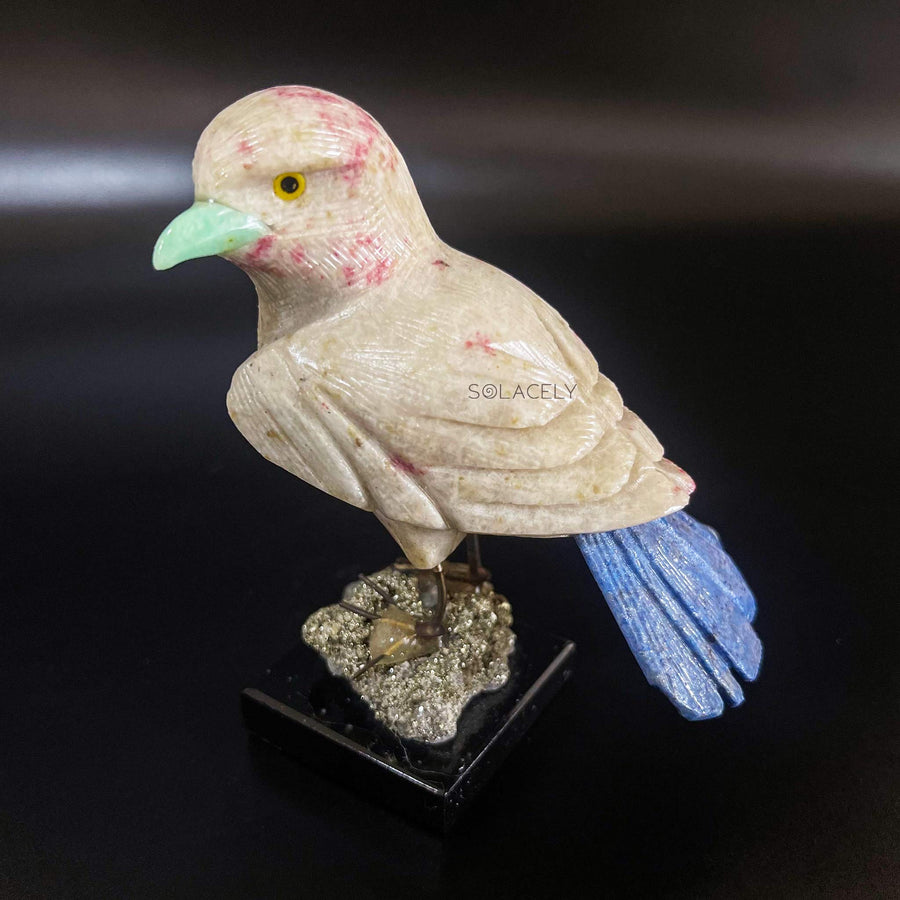 Sparkling bird figure on crystal base