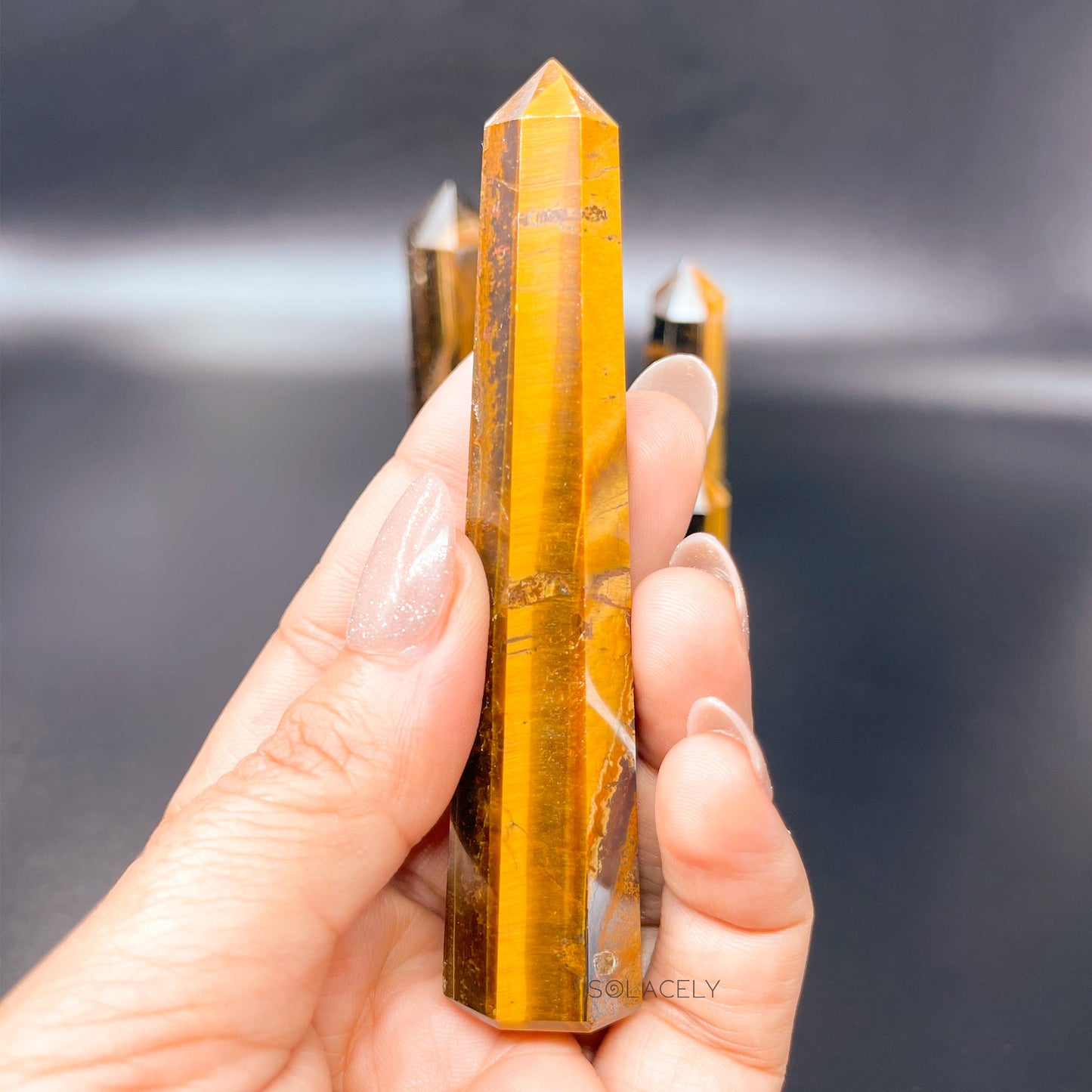 Tiger’s eye polished crystal point