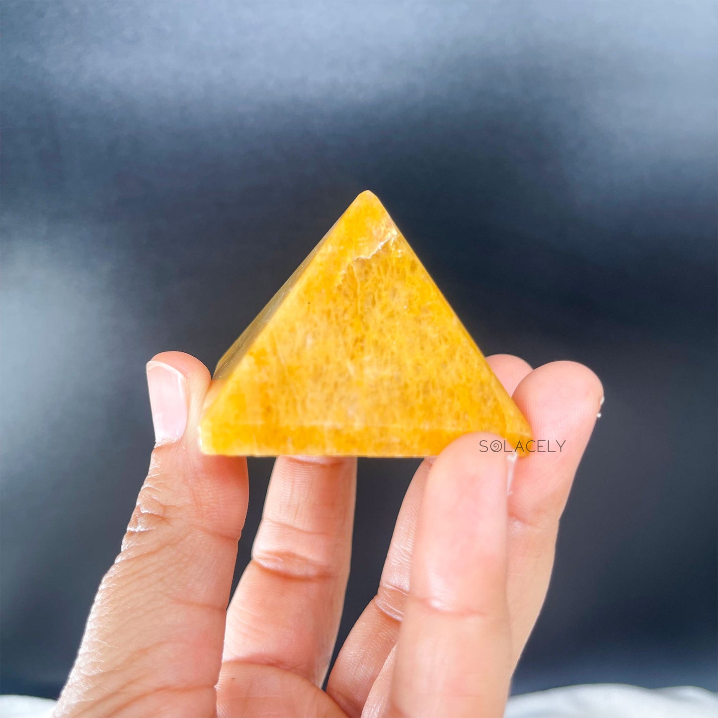 Yellow gemstone pyramid