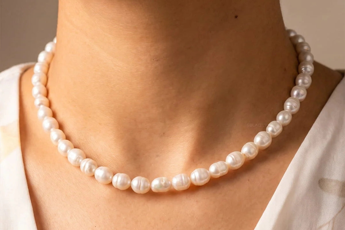 Woman wearing crystal bracelets in warm light, a considered gift for mom