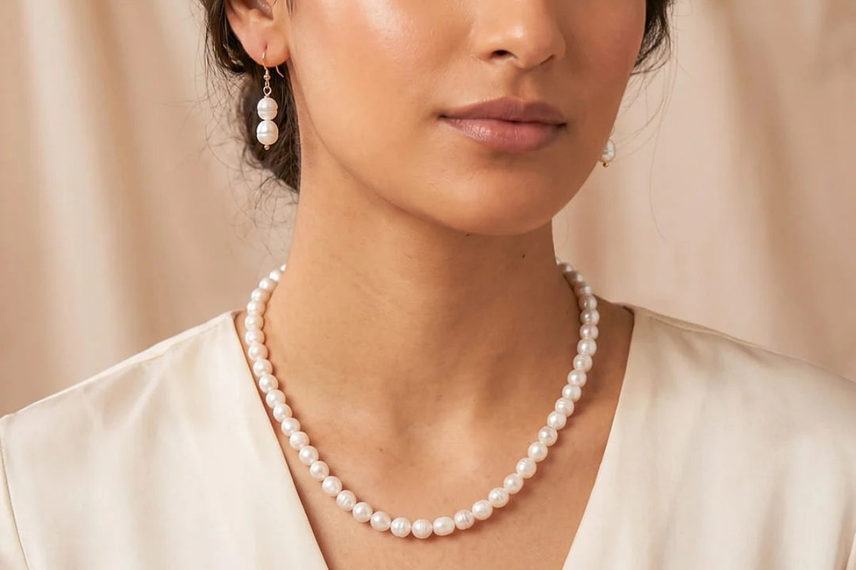 Woman in warm sunlight wearing stacked crystal bracelets, gift-ready