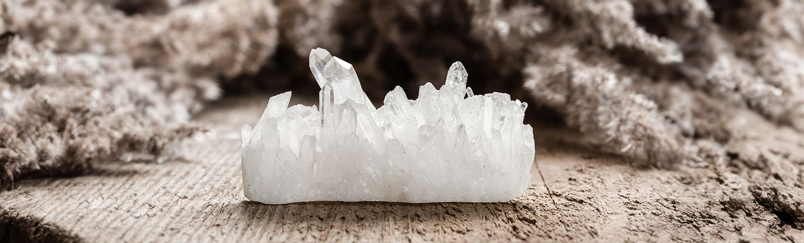 Clear quartz collection banner, natural clear quartz cluster in soft daylight