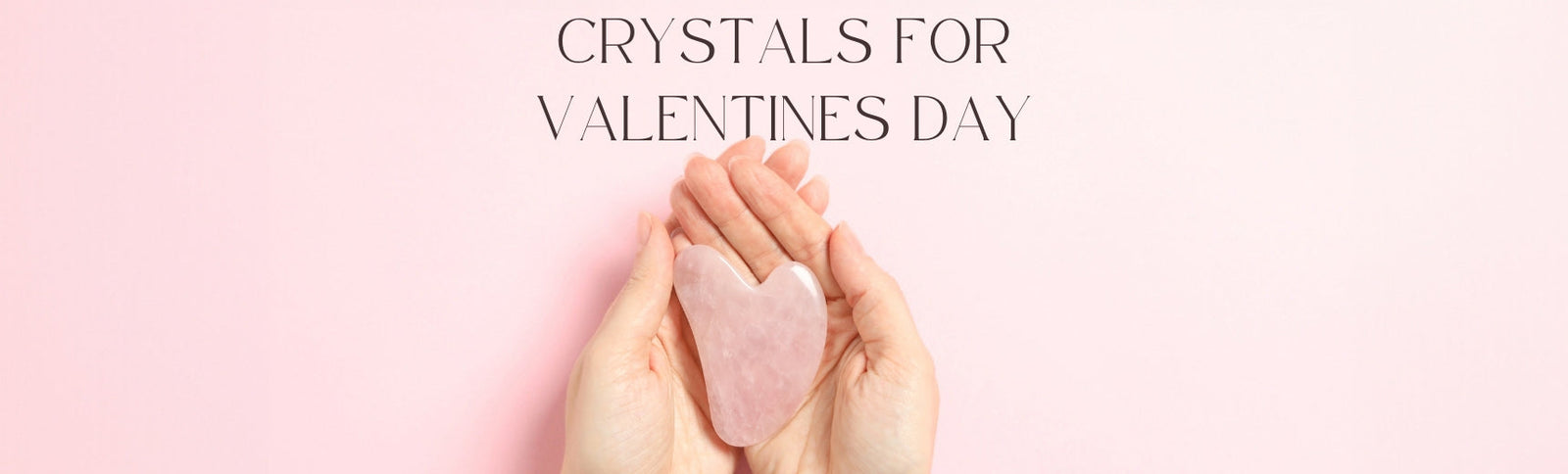 Valentine's gifts for her, a rose quartz heart held in cupped hands