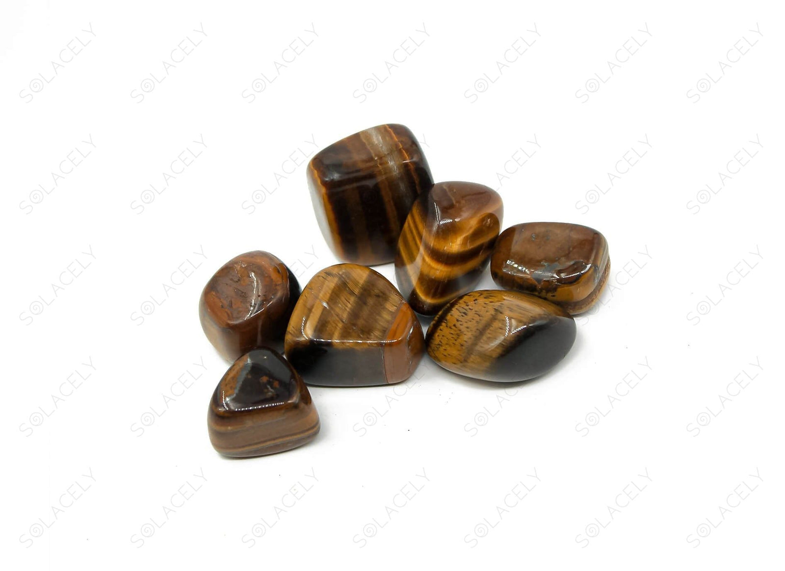 Golden-brown banded tiger eye tumble stone showing natural chatoyancy