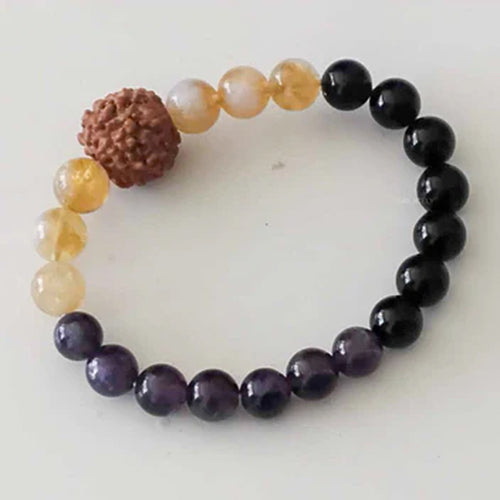 Amethyst beaded bracelet on a dark background