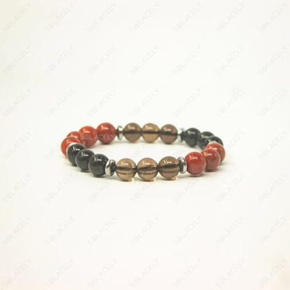 Root Chakra Crystal Bracelet with red, black, and brown stones.