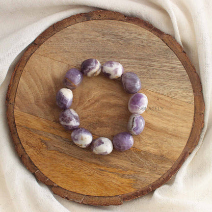 Amethyst Tumble Crystal Bracelet on round wooden base