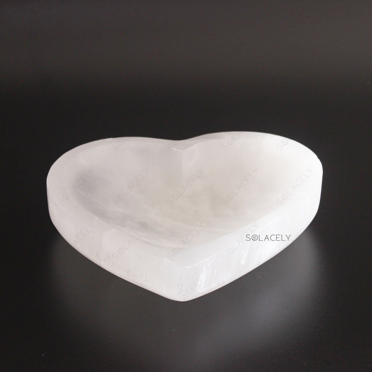 Selenite Heart Bowl on black background