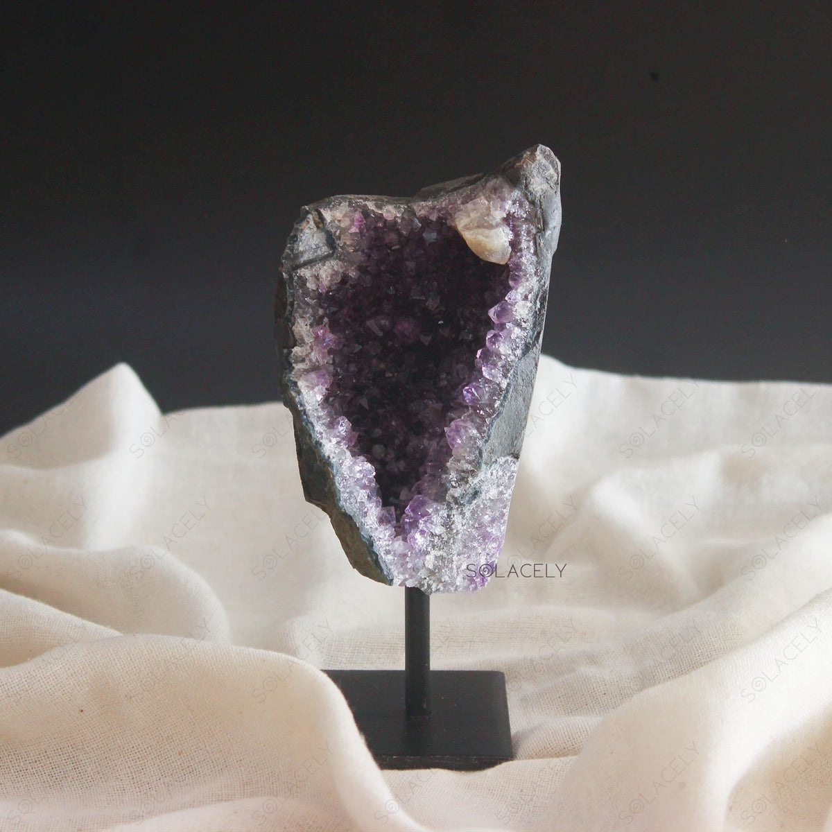 Crystal geode on display stand