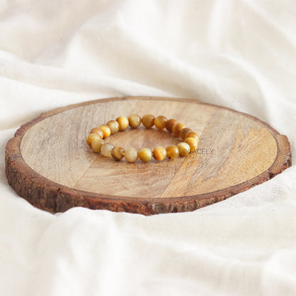 Cat's Eye Crystal Bracelet on round wooden base