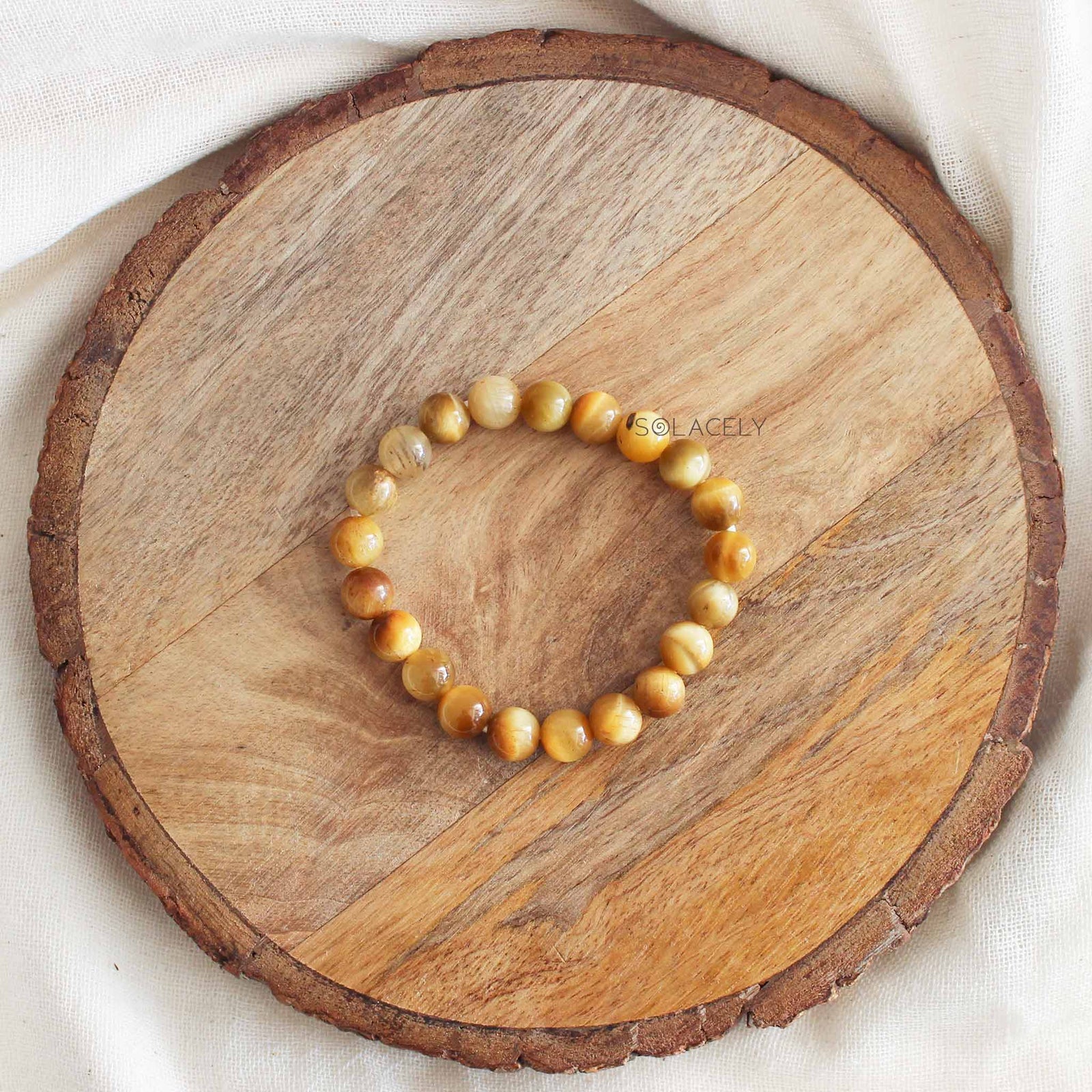 Cat's Eye Crystal Bracelet on wooden base