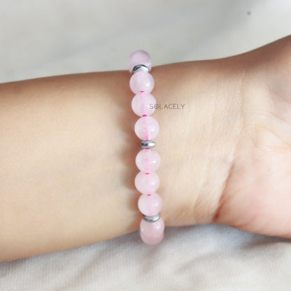 Pink rose quartz bracelet on wrist