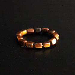 Tiger's Eye Tumble Crystal Bracelet on black background