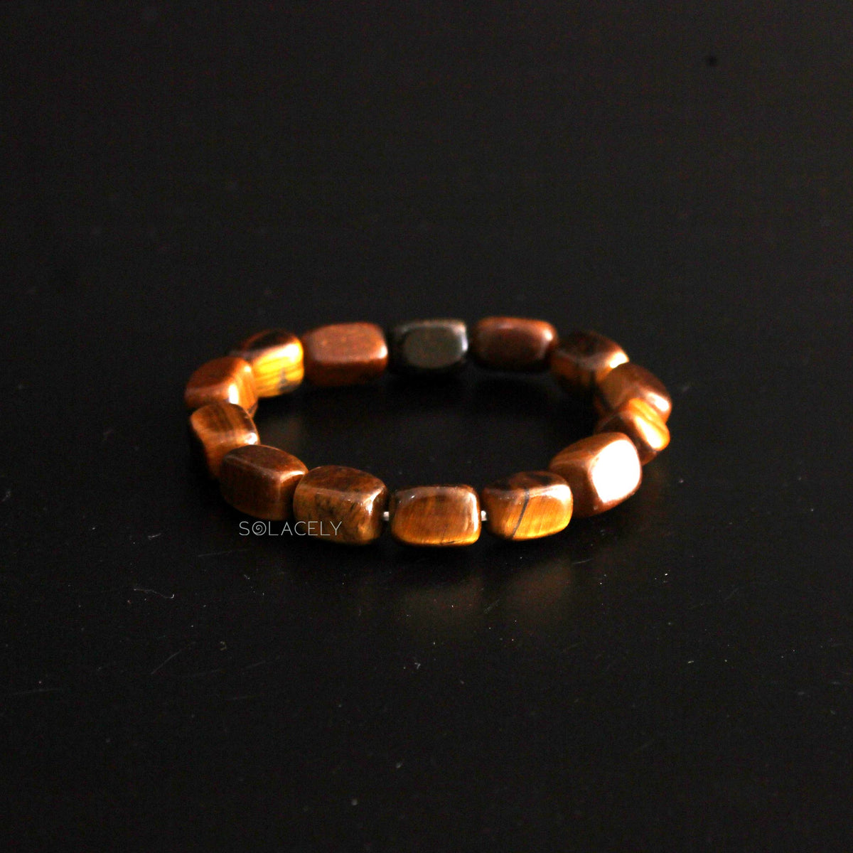 Black Tourmaline and Tiger's Eye Tumble Bracelet Set on bloack ground