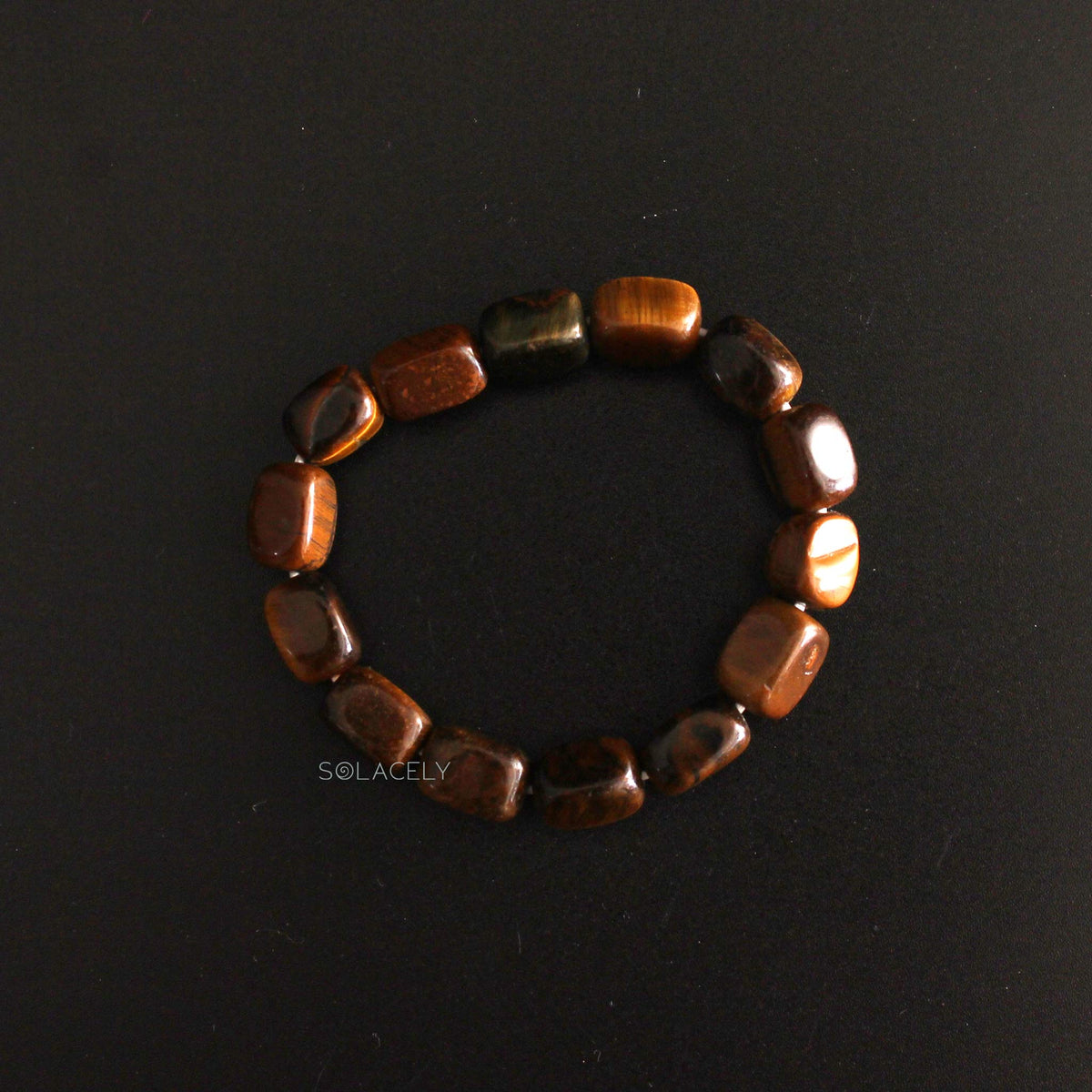 Tiger's Eye Tumble Polished Crystal Bracelet on black background