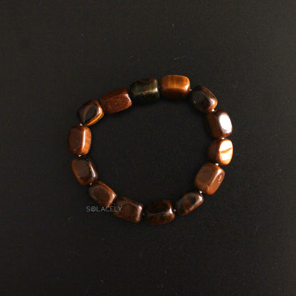 Tiger's Eye Tumble Polished Crystal Bracelet on black background