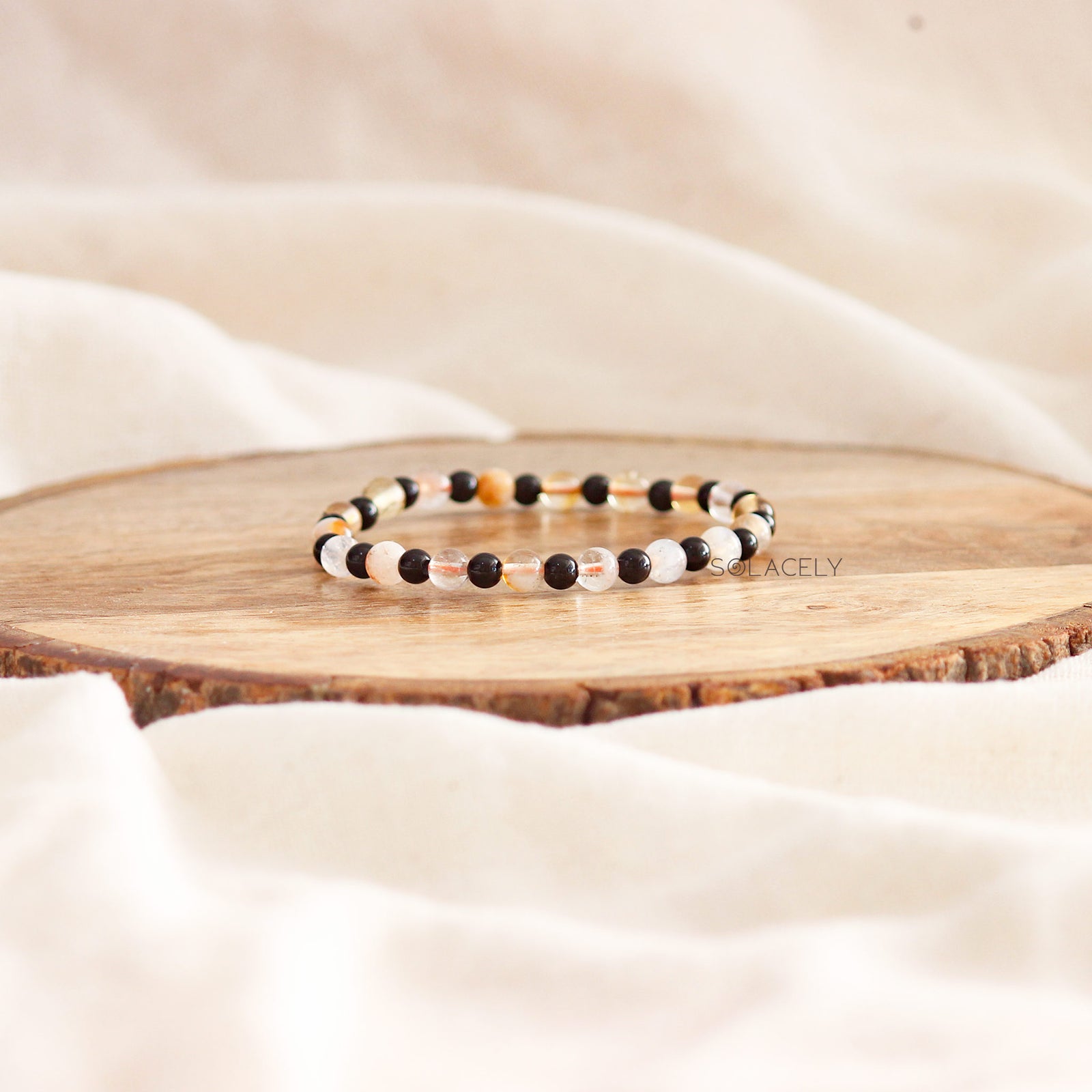 Colorful beaded bracelet on wooden desk