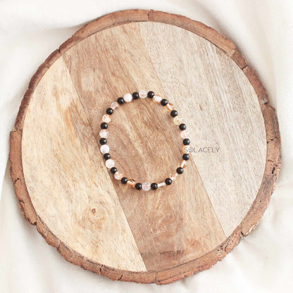 Gemstone bracelet on wooden platter