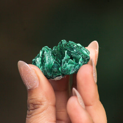 Raw malachite crystal specimen