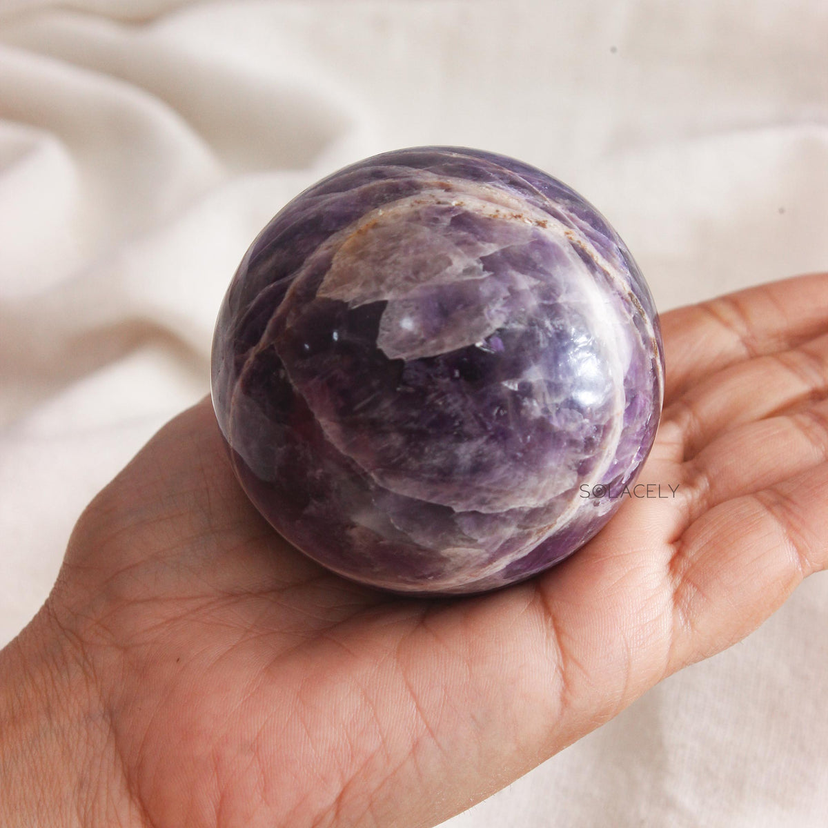 Round amethyst crystal with marbled texture
