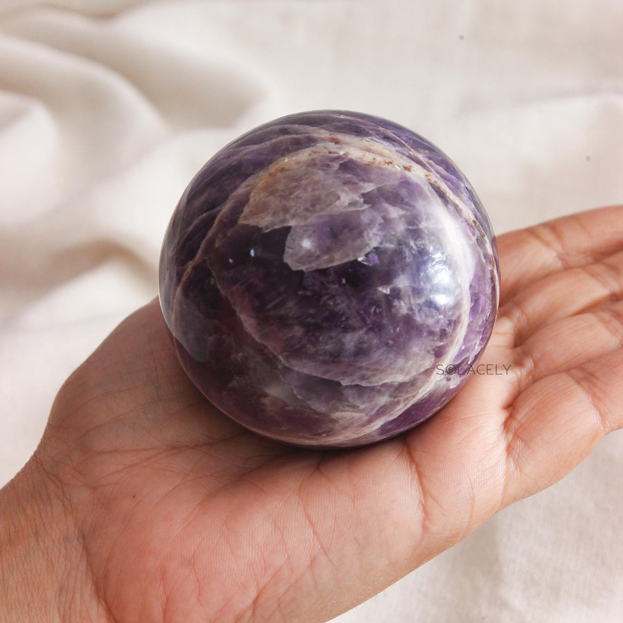 Round amethyst crystal with marbled texture