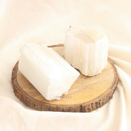 Two Selenite Raw Stones on wooden base