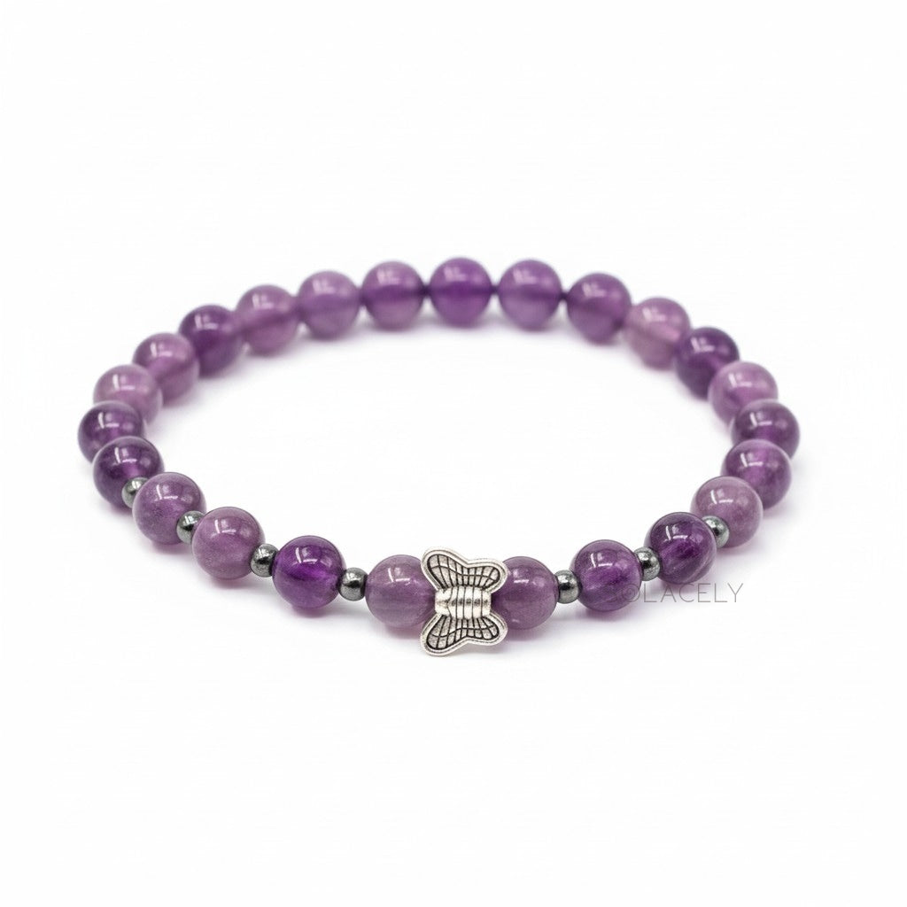 Amethyst bracelet with a silver butterfly charm at the wrist