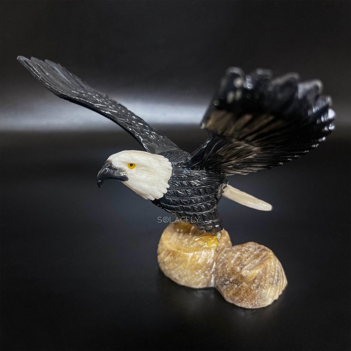 Bird statue on stone base