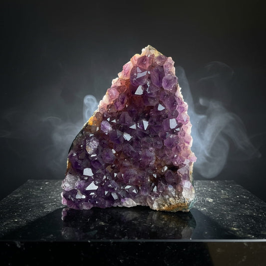Compact brazilian amethyst geode display stone