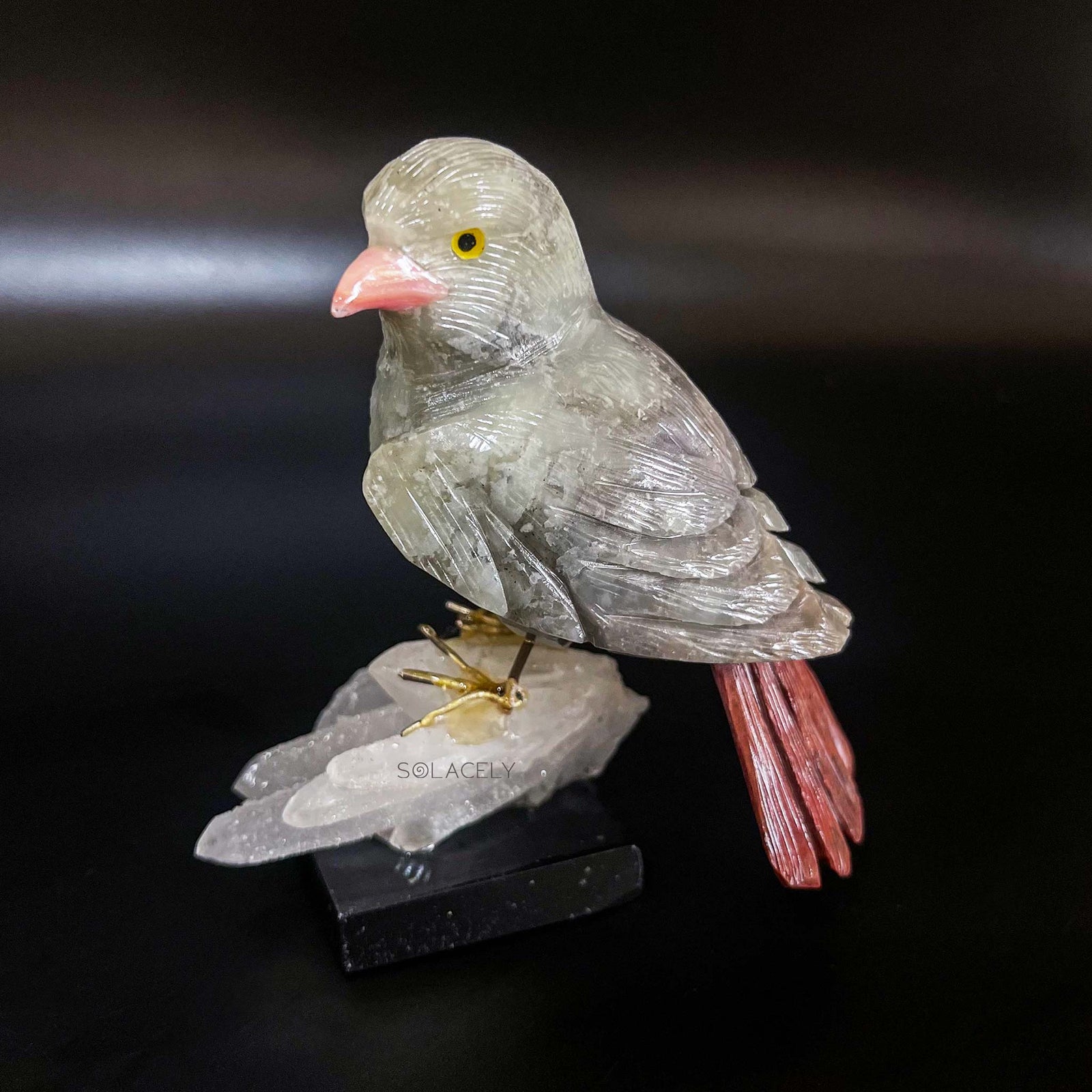 Crystal bird carving on stone base