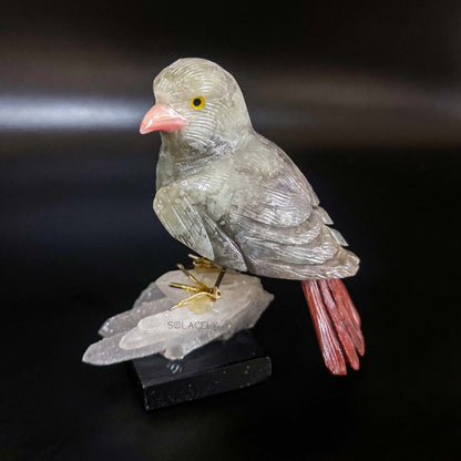 Crystal bird carving on stone base