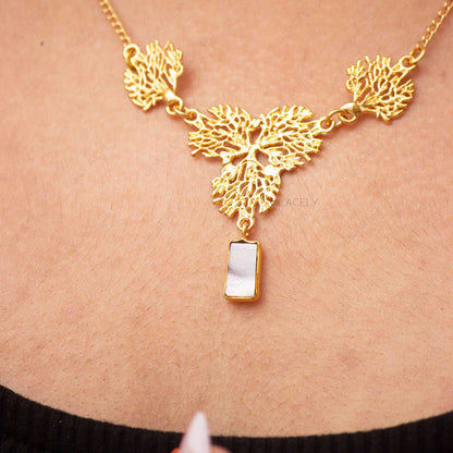 gold necklace with mother of pearl