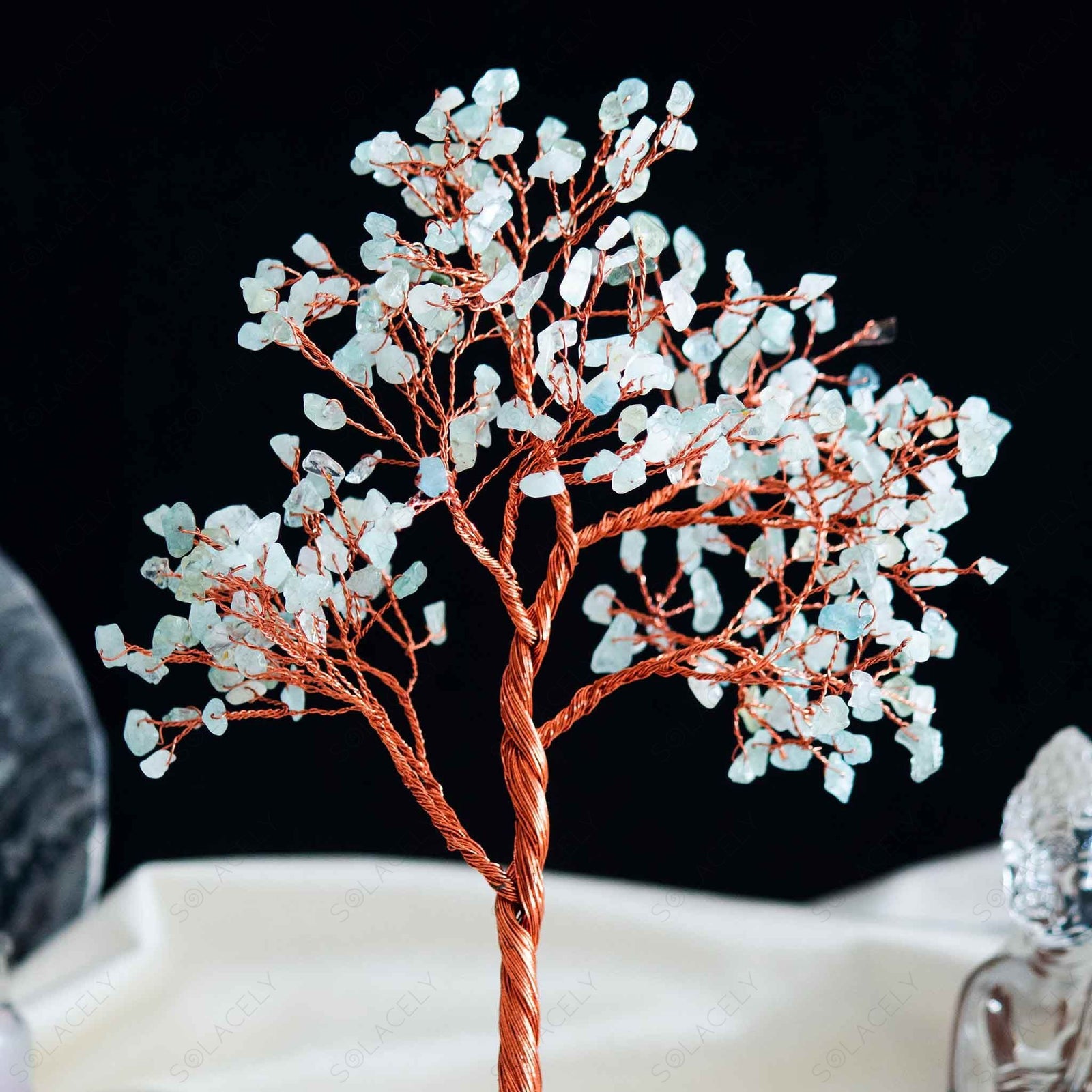 handcrafted aquamarine tree of life with polished agate base