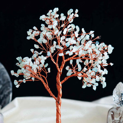 handcrafted aquamarine tree of life with polished agate base