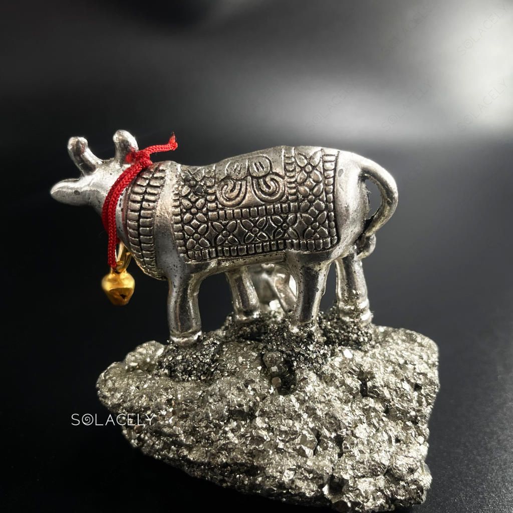 Sacred kamdhenu cow calf statue