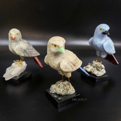 Shiny crystal bird on polished stone