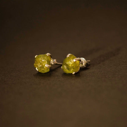 silver earrings with raw peridot