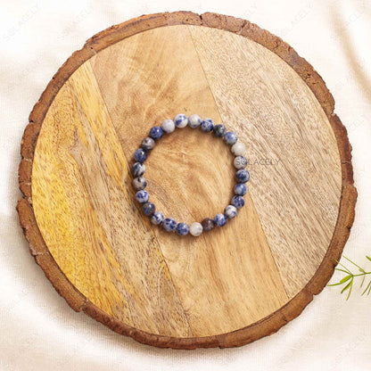 Sodalite Crystal 6mm Beads Bracelet on wooden base