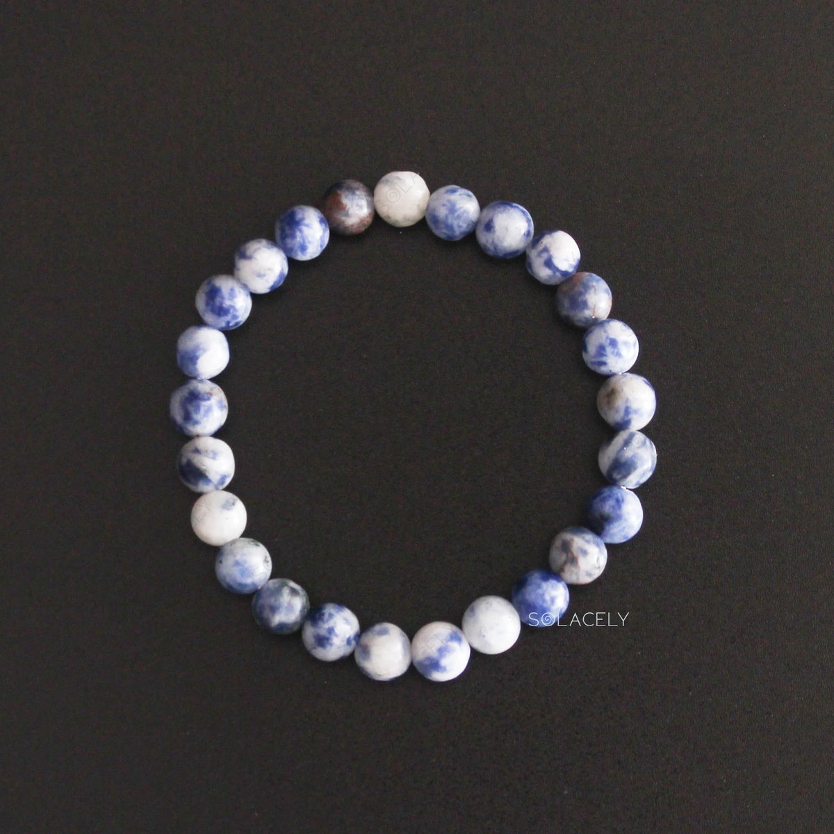 Sodalite Crystal 6mm Beads Bracelet top view on black background