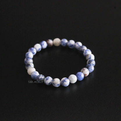 Sodalite Crystal 6mm Beads Bracelet on black background