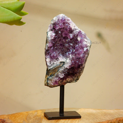 Purple crystal geode on stand