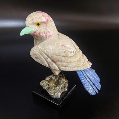 Sparkling bird figure on crystal base